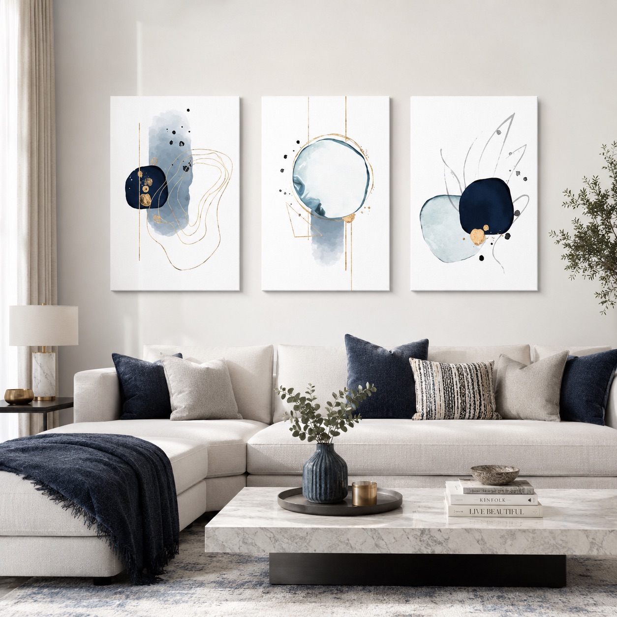 Plave apstraktne slike na platnu Playful Navy Blue prikazane u modernom dnevnom boravku